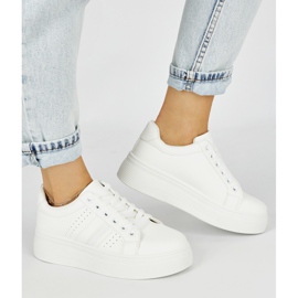 White sports sneakers on the platform 1