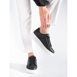 Black sneakers on the platform 2