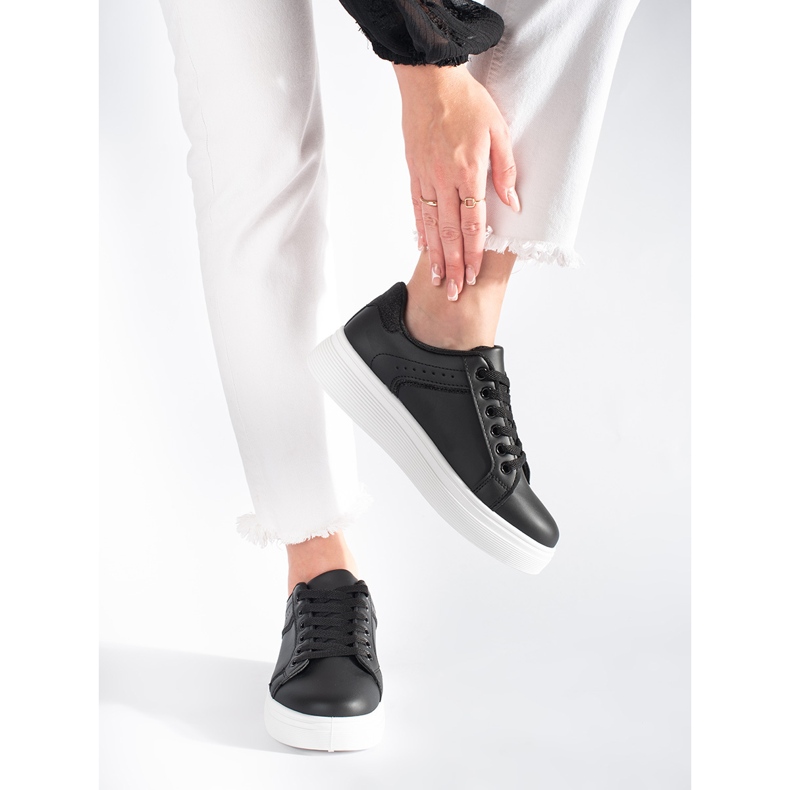 Black sneakers on the platform 2