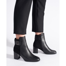 Black high-heeled ankle boots with a decorative strap 2