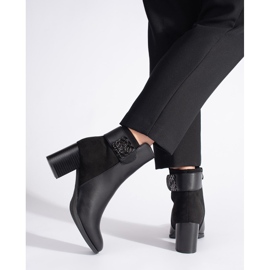 Black high-heeled ankle boots with a decorative strap 3