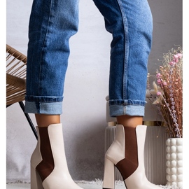 Beige Chelsea boots on the Hamilt post 1
