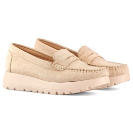 Comfortable beige women's moccasins with a thick sole and leather insole. 1