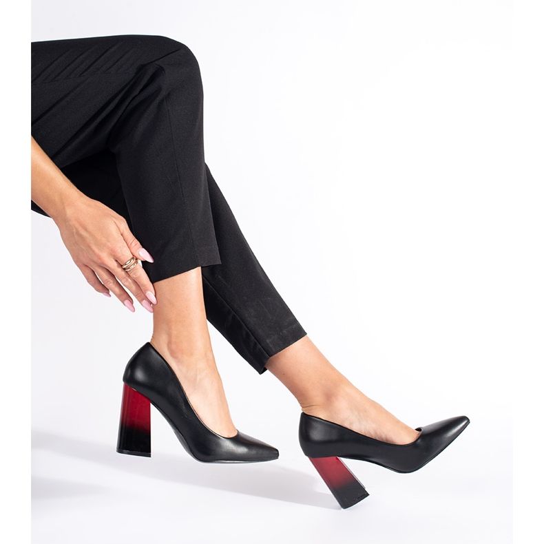Ladies' black pumps on the post 1