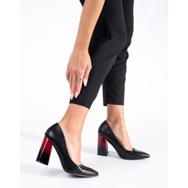 Ladies' black pumps on the post 2