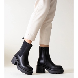 Black ankle boots with a massive Tharney heel 1