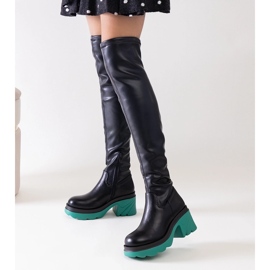 Black insulated boots with a massive Meragomi block 1