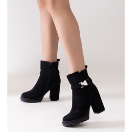 Black high-heeled ankle boots decorated with a Torhia buckle 1