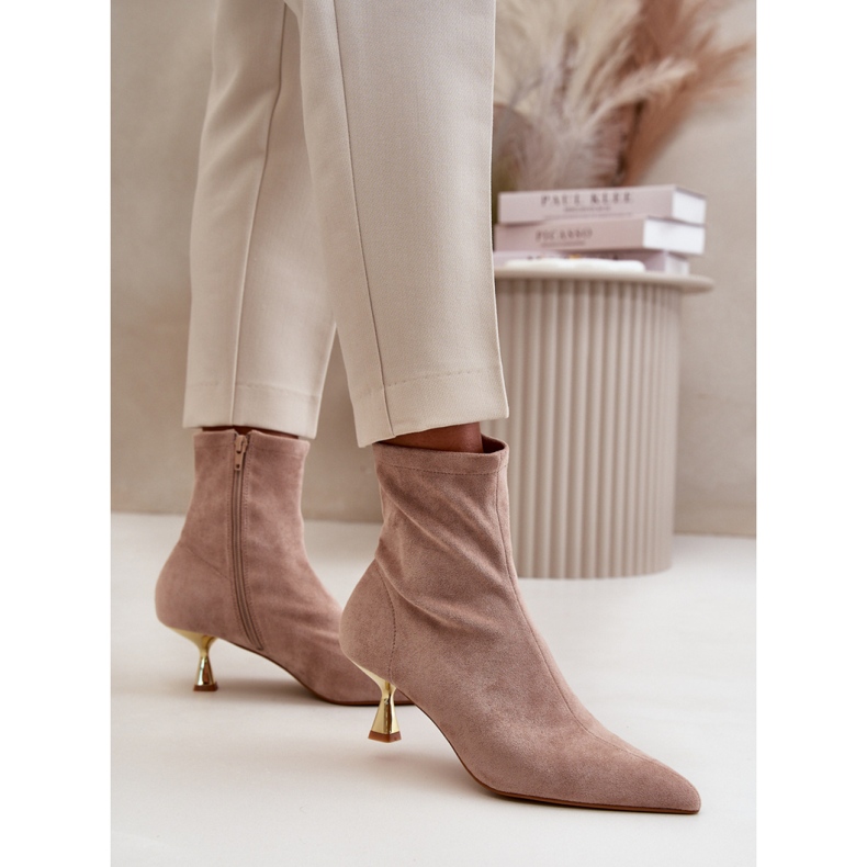 Stylish women's boots with a decorative beige high heel 1