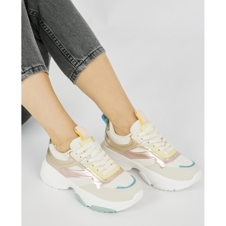 Women's sports shoes with a thick sole golden 1