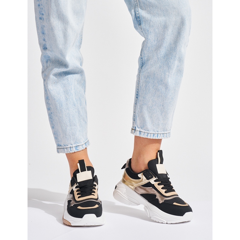 Black and gold sneakers with a thick sole 1