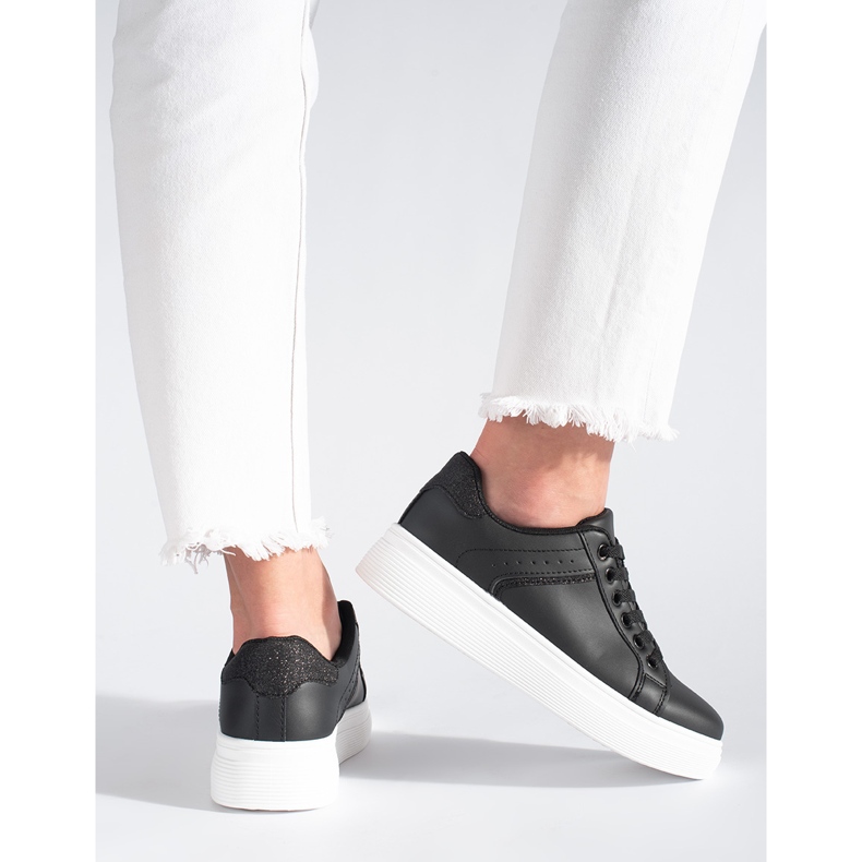 Black sneakers on the platform 1