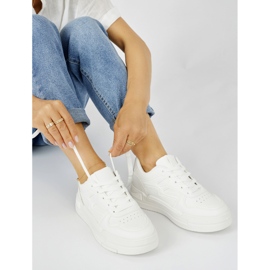 Women's white sneakers on the platform 1