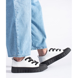 Black and white low sneakers made of genuine leather 1