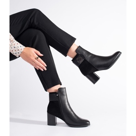 Black high-heeled ankle boots with a decorative strap 1