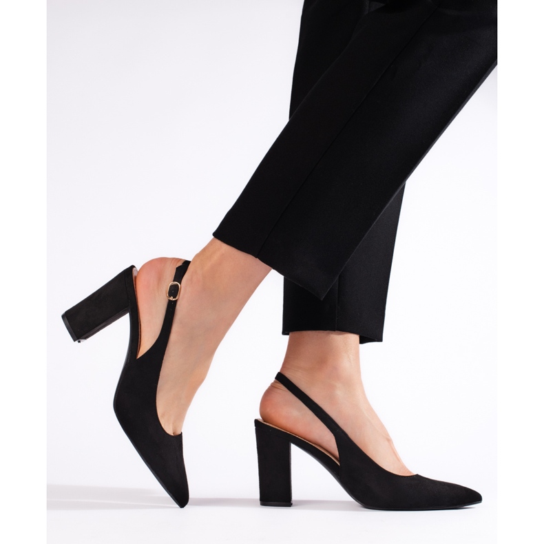 Black pumps with an open heel 1