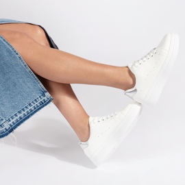 White sneakers on the platform 2