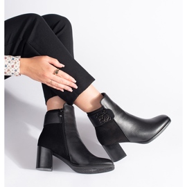 Black high-heeled ankle boots with a decorative strap 4