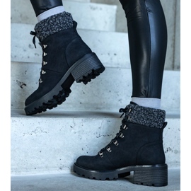 Black lace-up boots decorated with a Moses sheepskin coat 1
