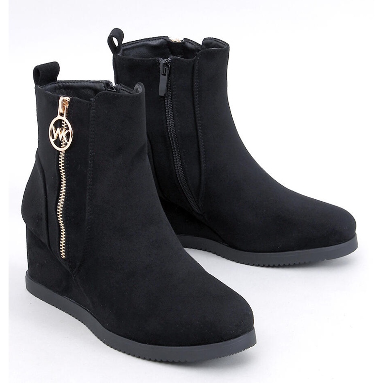 Black women's wedge boots with a gold zipper 1
