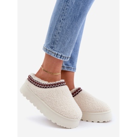 Light beige sheepskin slippers on a platform with fur 1