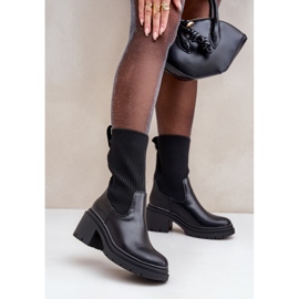 Boots with a sock on a massive black heel 2