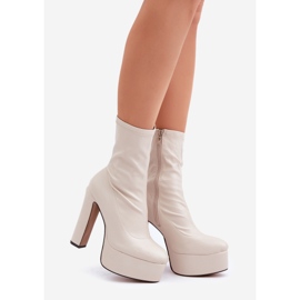 Light beige high-heeled ankle boots with a stiletto heel and a platform 1