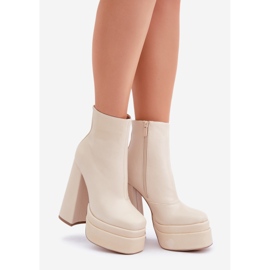 Light beige warm boots on a massive platform and high heel 1