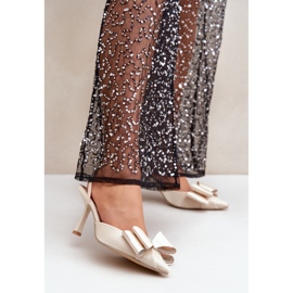 Step in style Elegant women's gold high heels with a bow golden 1