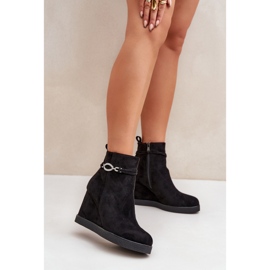 Black wedge ankle boots with a decorative strap 1
