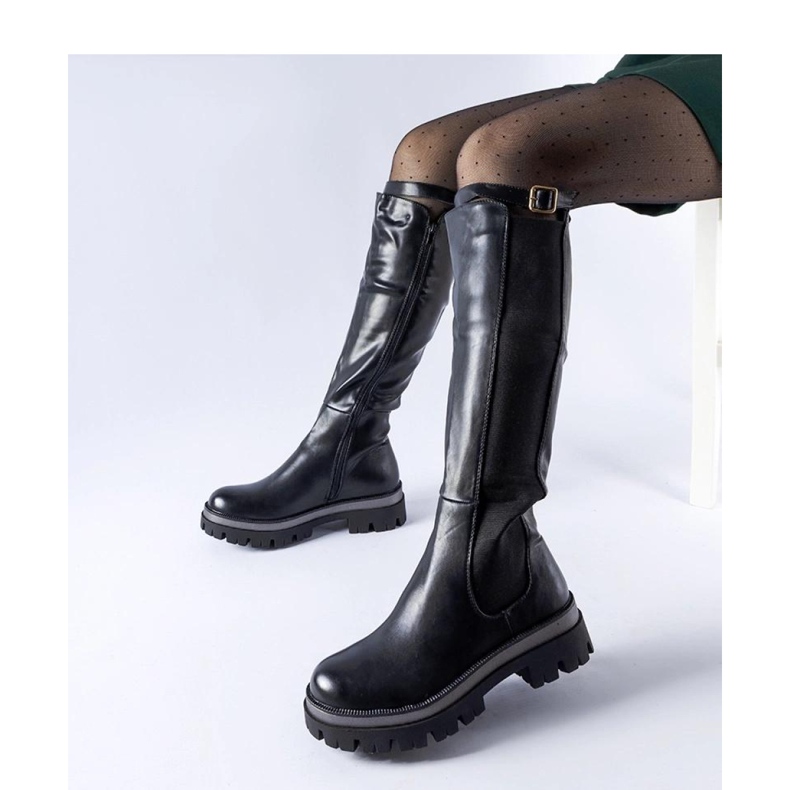 Black massive boots with a decorative belt from Stuart - Solea 1