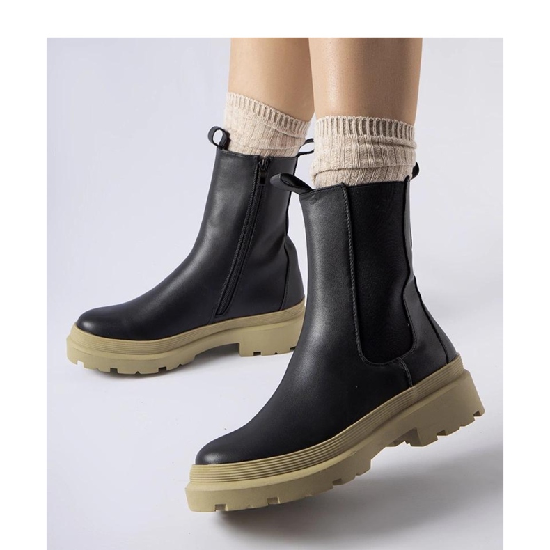 Black ankle boots with an olive sole 1