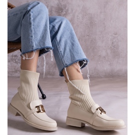 Beige ankle boots with a fabric upper 1