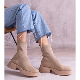 Beige ankle boots with a flexible upper 1