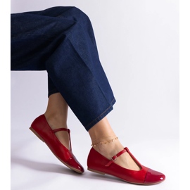 Red ballet flats with a patent toe and fastened with a buckle 1