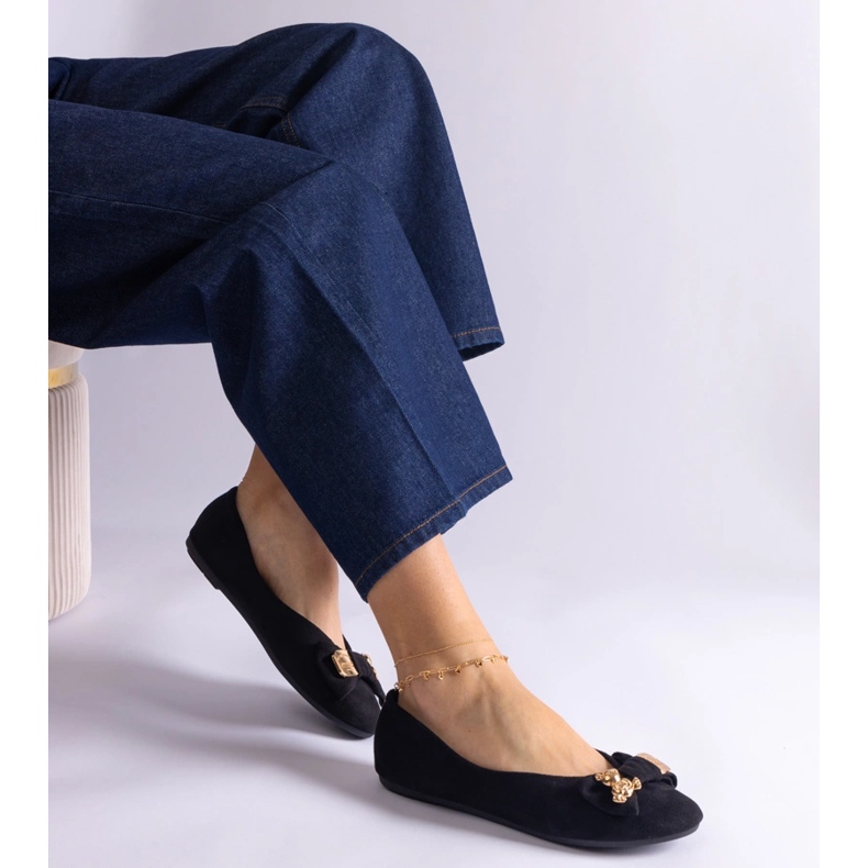 Black ballet flats decorated with a bow and brooch 1