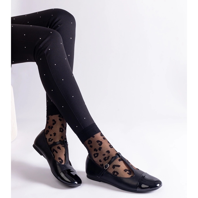 Black ballet flats with a patent toe and fastened with a buckle 1