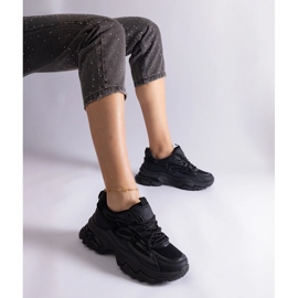 Black sports sneakers on a massive sole 1 Black sports sneakers on a massive sole 1