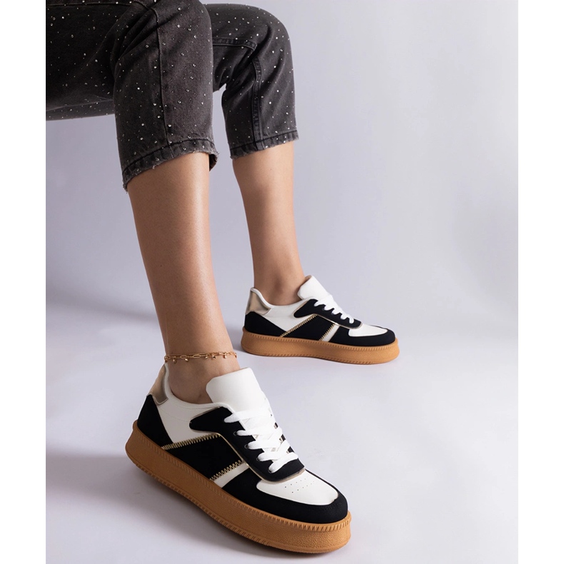 Black sneakers laced on the platform 1 Black sneakers laced on the platform 1