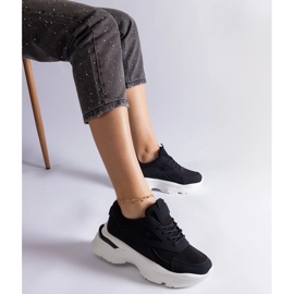 Black sneakers with a thick sole 1 Black sneakers with a thick sole 1