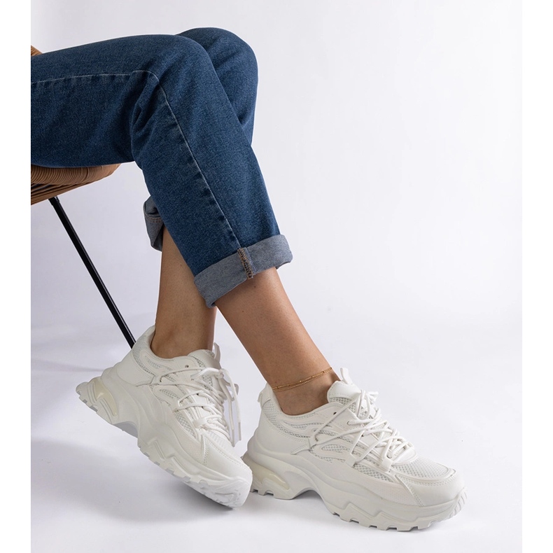 White sports sneakers with a massive sole 2