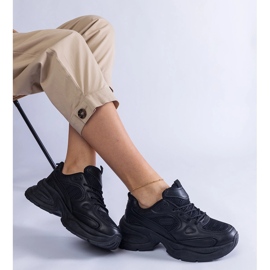 Black sneakers on a massive sole 1