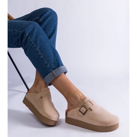 Beige women's flip flops on the platform with a buckle 1
