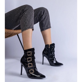 Black boots varnished on a pin with buckles 1