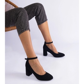Black pumps on the eco-leather pillar 1