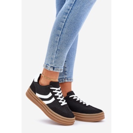 Stylish sneakers on the black and white platform 1