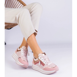 Pink sports sneakers on the platform decorated with glitter 1