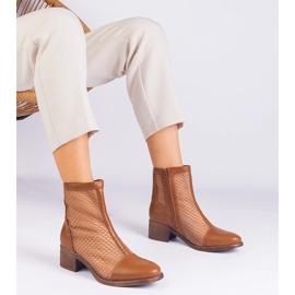 Brown mesh boots on the post 1