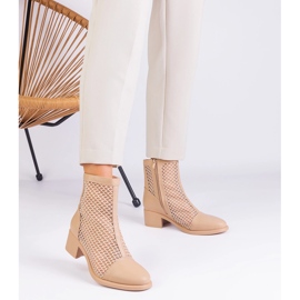 Beige mesh boots on the post 1