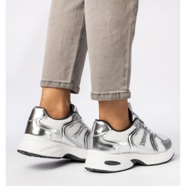 Women's silver sneakers on the platform 1